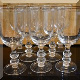 K34. Set of 8 glass goblets. 8.5”h x 4”w - $16 